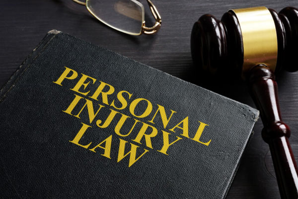 personal injury law book and gavel