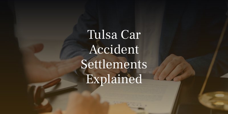 Attorney meeting with client to review documents during a car accident case in Tulsa.