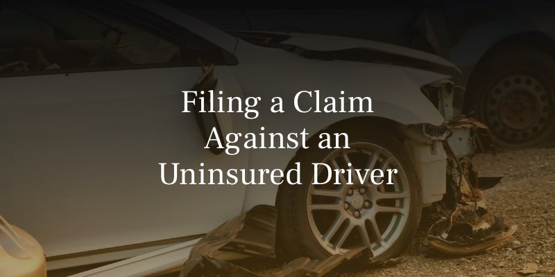 Damaged white car after an accident, representing claims against uninsured drivers in Oklahoma.